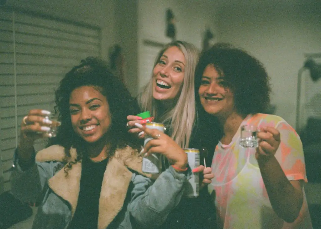 in an article about drinking culture, three people drinking alcohol