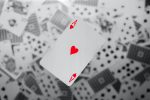 in an article about casino technology, an ace of hearts card in front of other playing cards