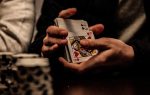 in an article about gambling, someone shuffling playing cards