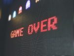 Image of a game over, classic Pac-Man sign for an article about Ubisoft prioritizing free-to-play games.