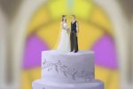 Wedding cake toppers featuring a traditional bride in a white dress and groom in a black suit demonstrate the heteronormativity of the wedding industry.