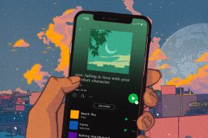 To demonstrate the art of niche Spotify playlists, an illustration depicts a hand holding a cellphone displaying a playlist titled "pov: falling in love with your comfort character."