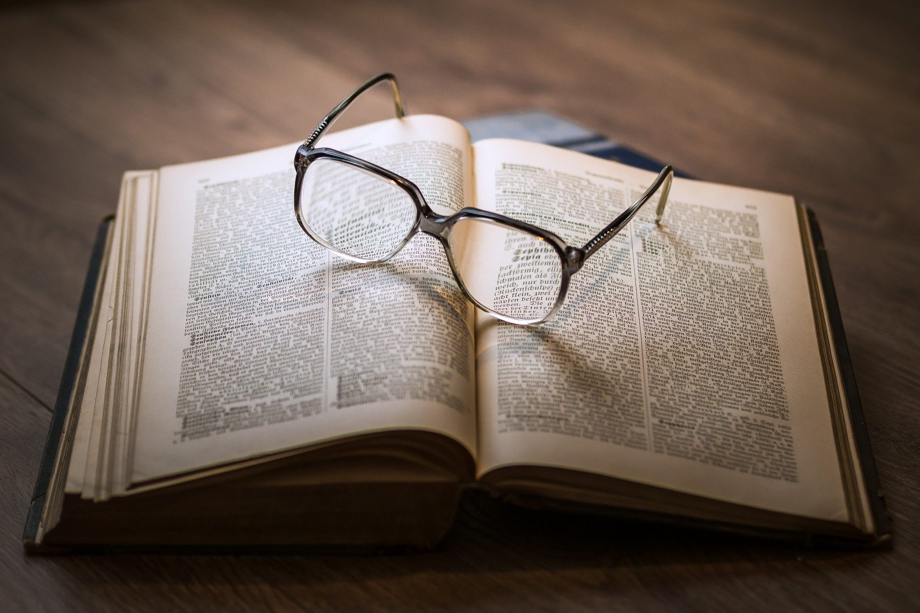 In an article about Warby Parker, an image of glasses on top of a book
