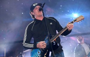 Tom DeLonge sings and plays guitar with band Angels & Airwaves