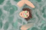 A person floats in a pool with cucumber peels over their eyes for an article about self-care.