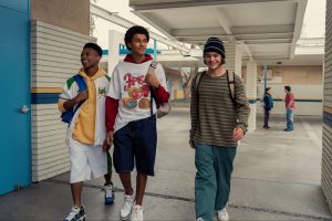 Photo of young Colin Kaepernick walking with friends from show Colin in Black and White