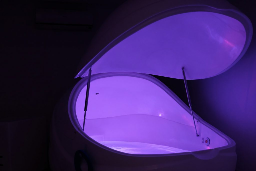 A purple float tank for an article about sensory deprivation.