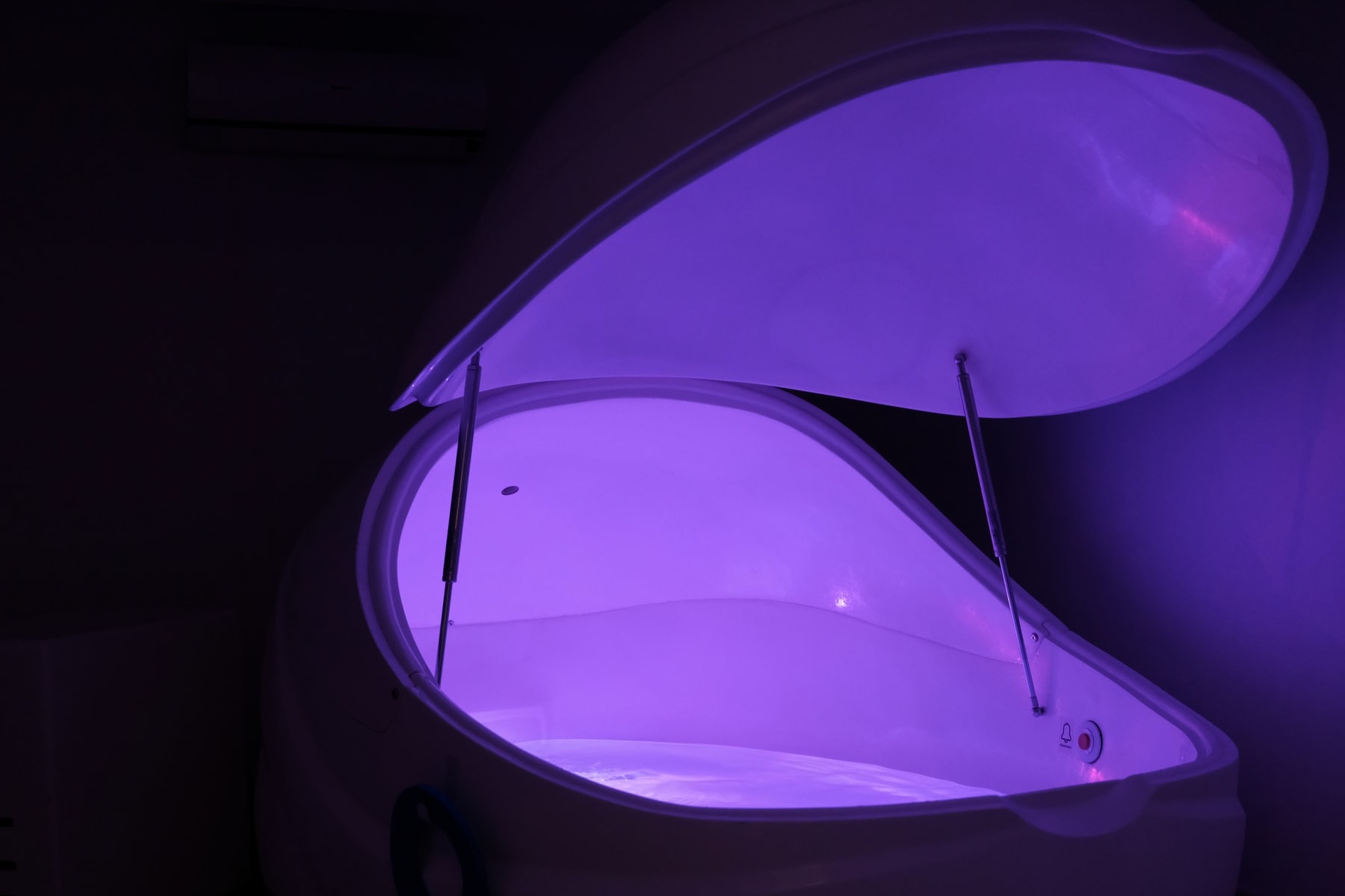 A purple float tank for an article about sensory deprivation.