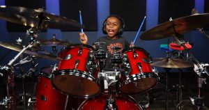 Talented child drummer Justin Wilson II poses with the drums during his performance of Earth, Wind & Fire's "September."