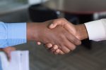 in an article about negotiation, two shaking hands