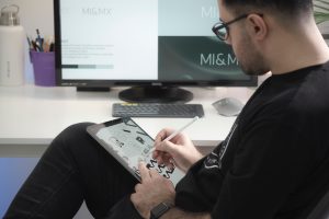 in article about design students, someone on an tablet designing something