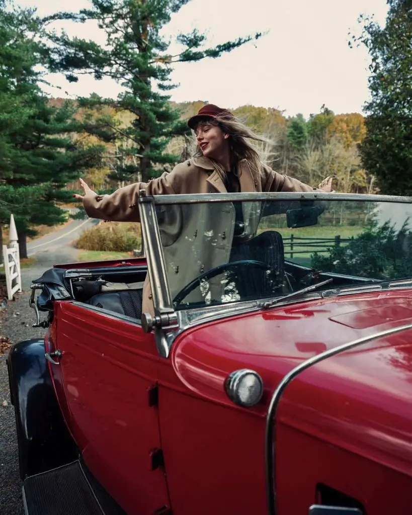 in article about Red (Taylor's Version), image of Taylor Swift in car