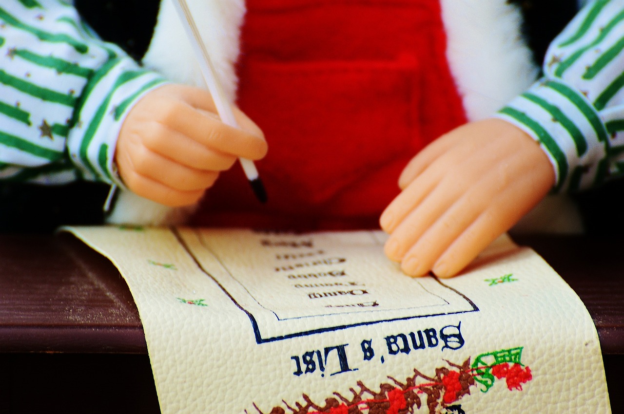 Photo of a puppet's hands marking off names on a list titled "Santa's List" for an article about Christmas lists.