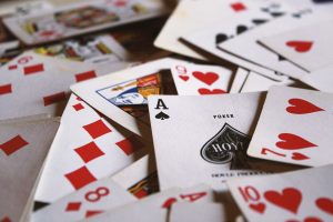 in an article about online casinos, a bunch of playing cards