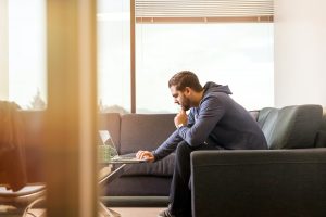 in article about picking a bookmaker, a person sitting looking at their laptop