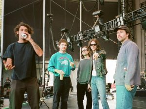 The Neighbourhood standing backstage