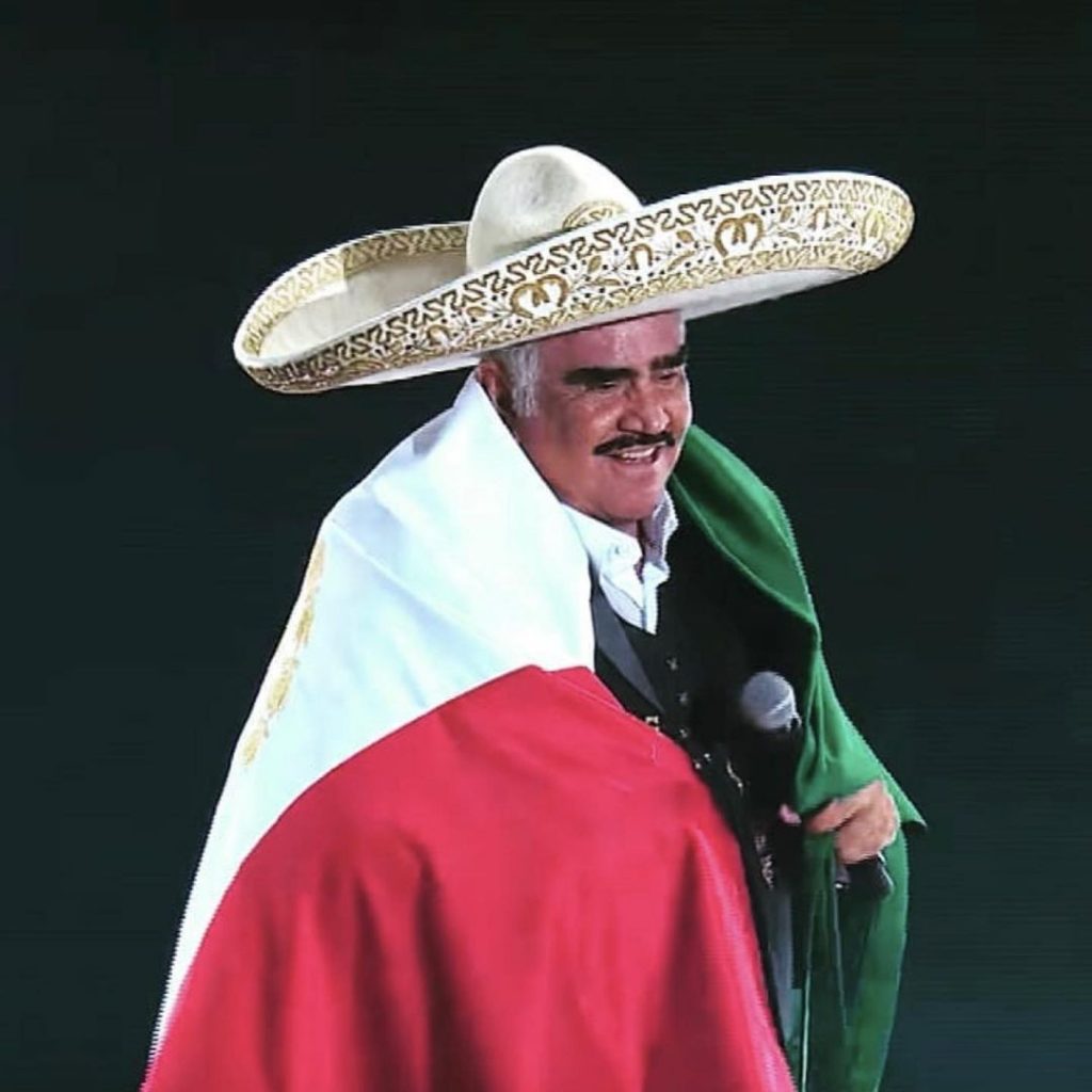 Vicente Fernandez draped in the Mexican flag