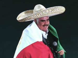 Vicente Fernandez draped in the Mexican flag