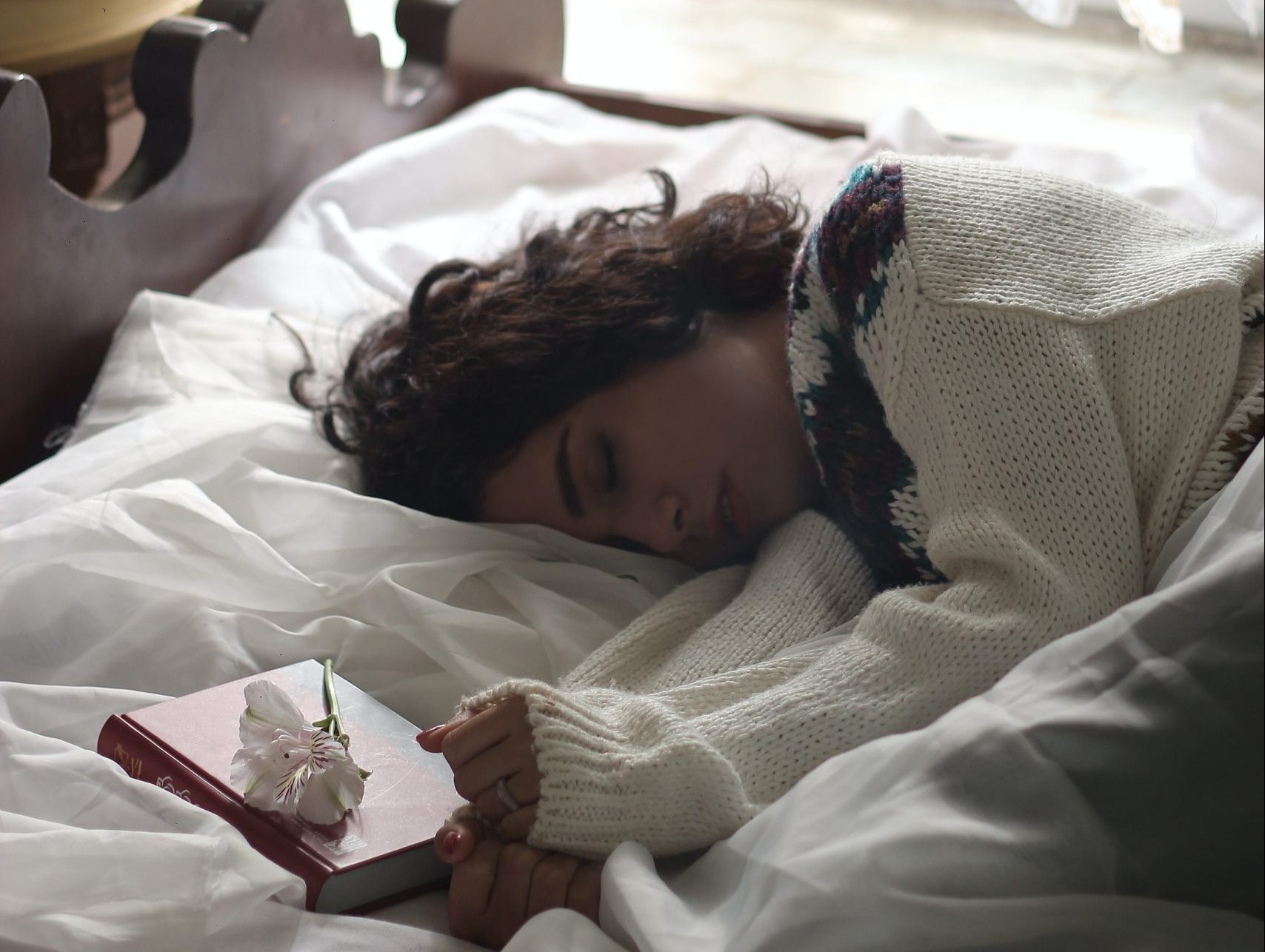 A photo of a woman sleeping for an article about relaxation during Christmas break.
