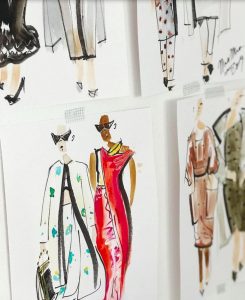 Cluster of fashion design illustrations primarily showing two women, one wearing a red dress and one wearing a white kimono style top.