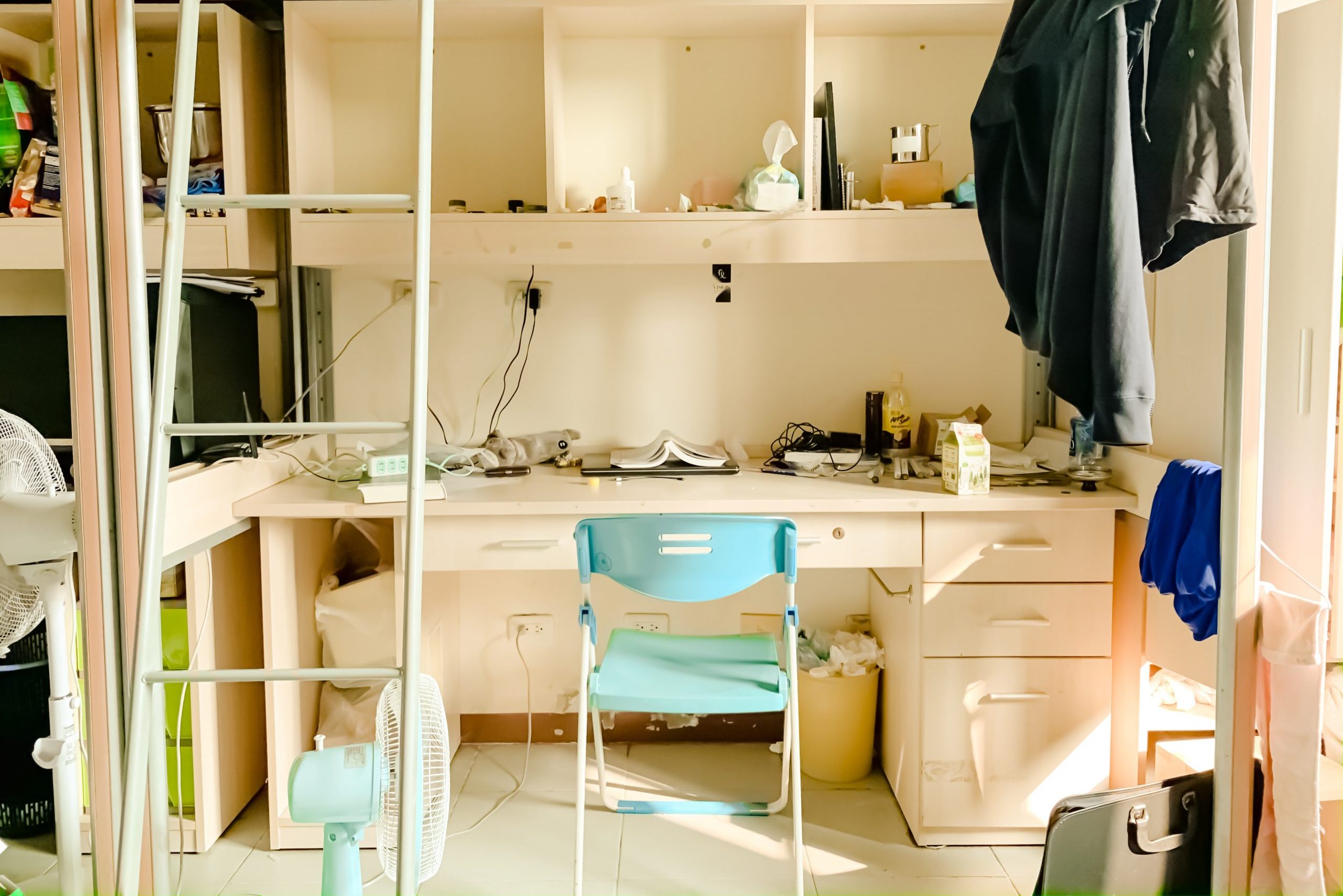 Photo of a dorm room in an article about living at home.