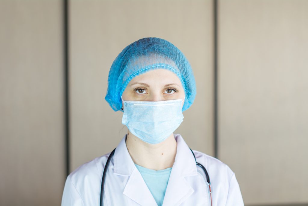 in an article about online nursing students, a nurse wearing a mask
