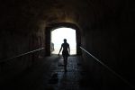 in article about overcoming an eating disorder, a person walking out of a tunnel