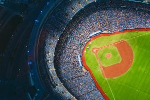 in article about the designated hitter rule, an aerial view of a baseball stadium