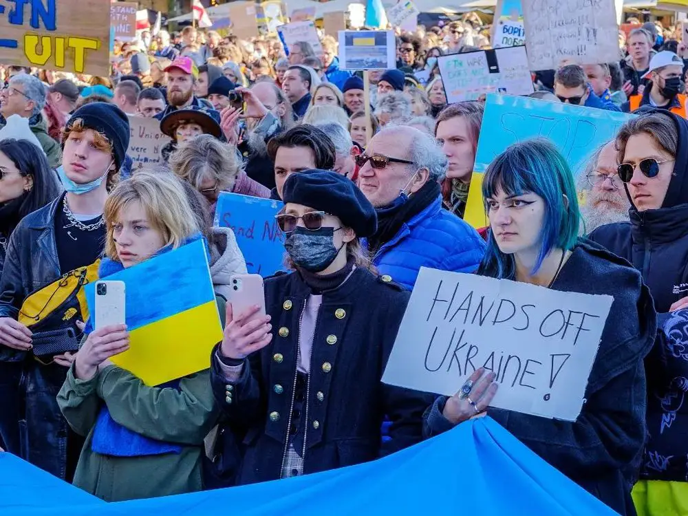 Protestors standing in solidarity with Ukraine against Putin's invasion