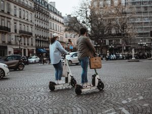 two people on e-scooters