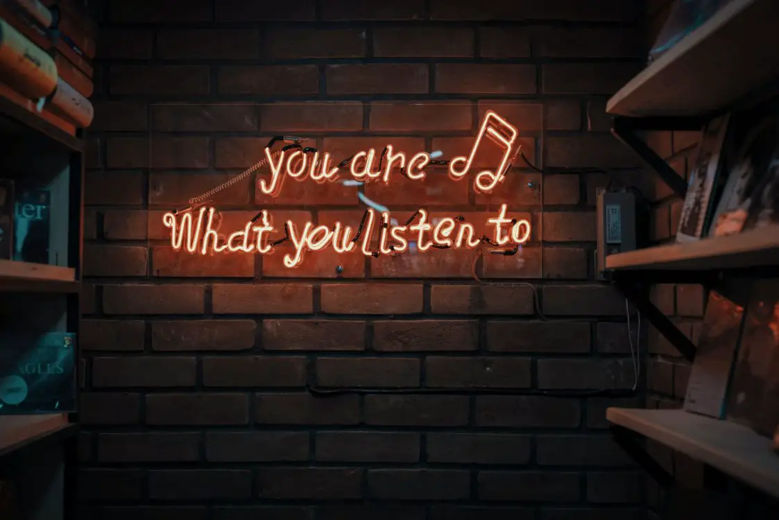 Reflective of the villain era, a neon light states you are what you listen to.