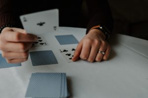 in article about casino games, someone playing a card game