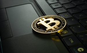 Bitcoin token on laptop