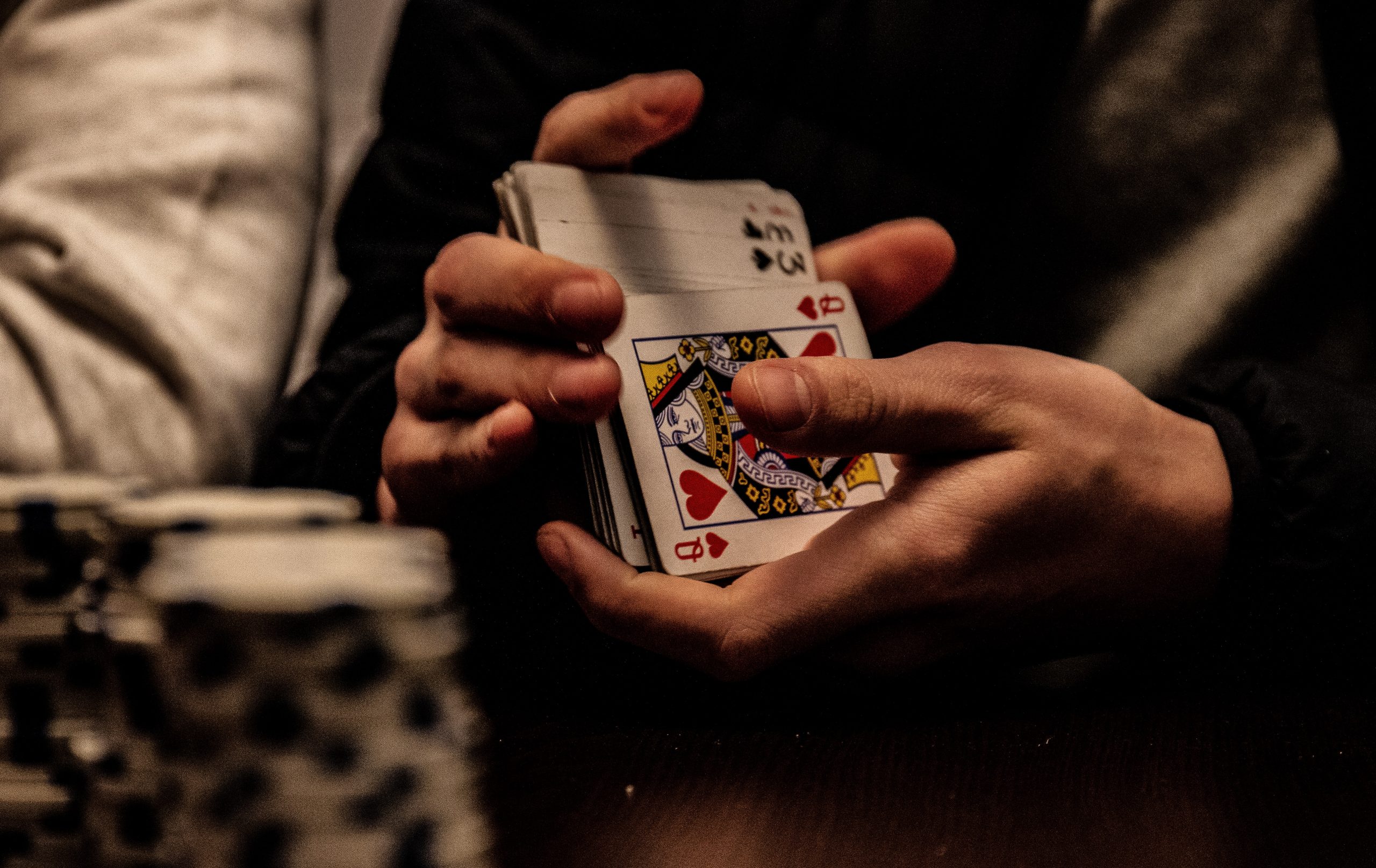 in an article about micro stakes poker, someone shuffling a deck of cards