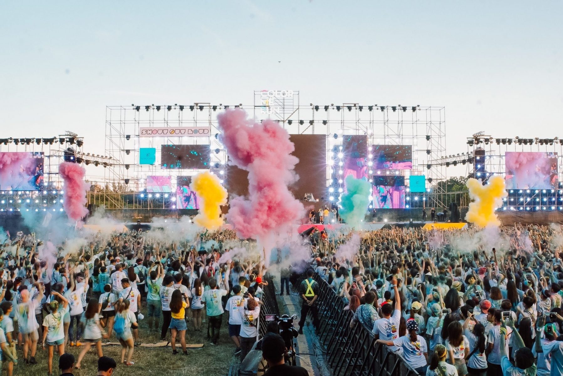 in article about rave outfits, a photo of an outdoor festival