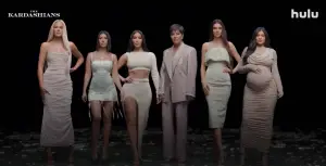 the kardashians lined up against dark backdrop
