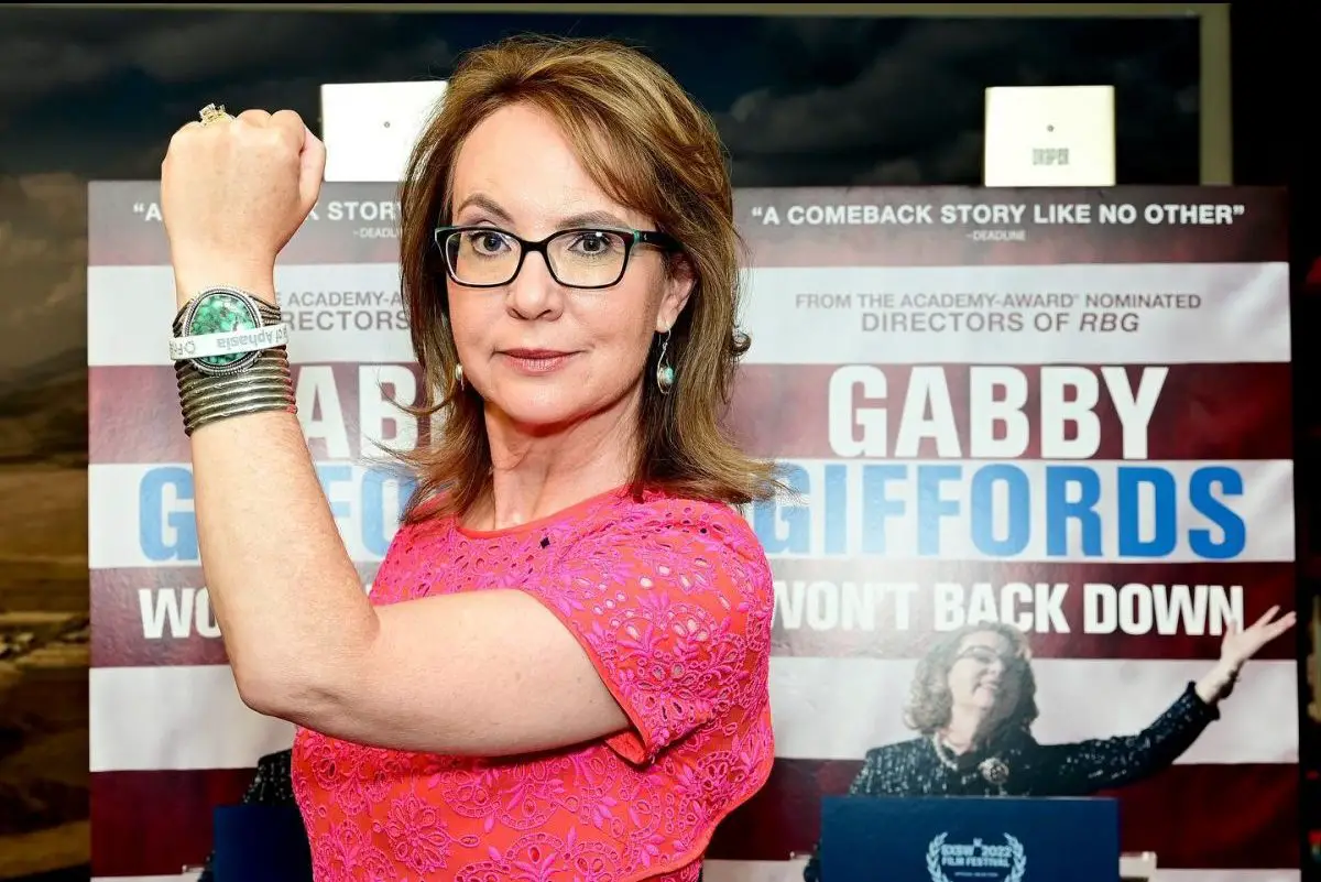in article about gabby giffords won't back down, gabby giffords in front of movie poster