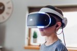 Kid wearing VR headset.