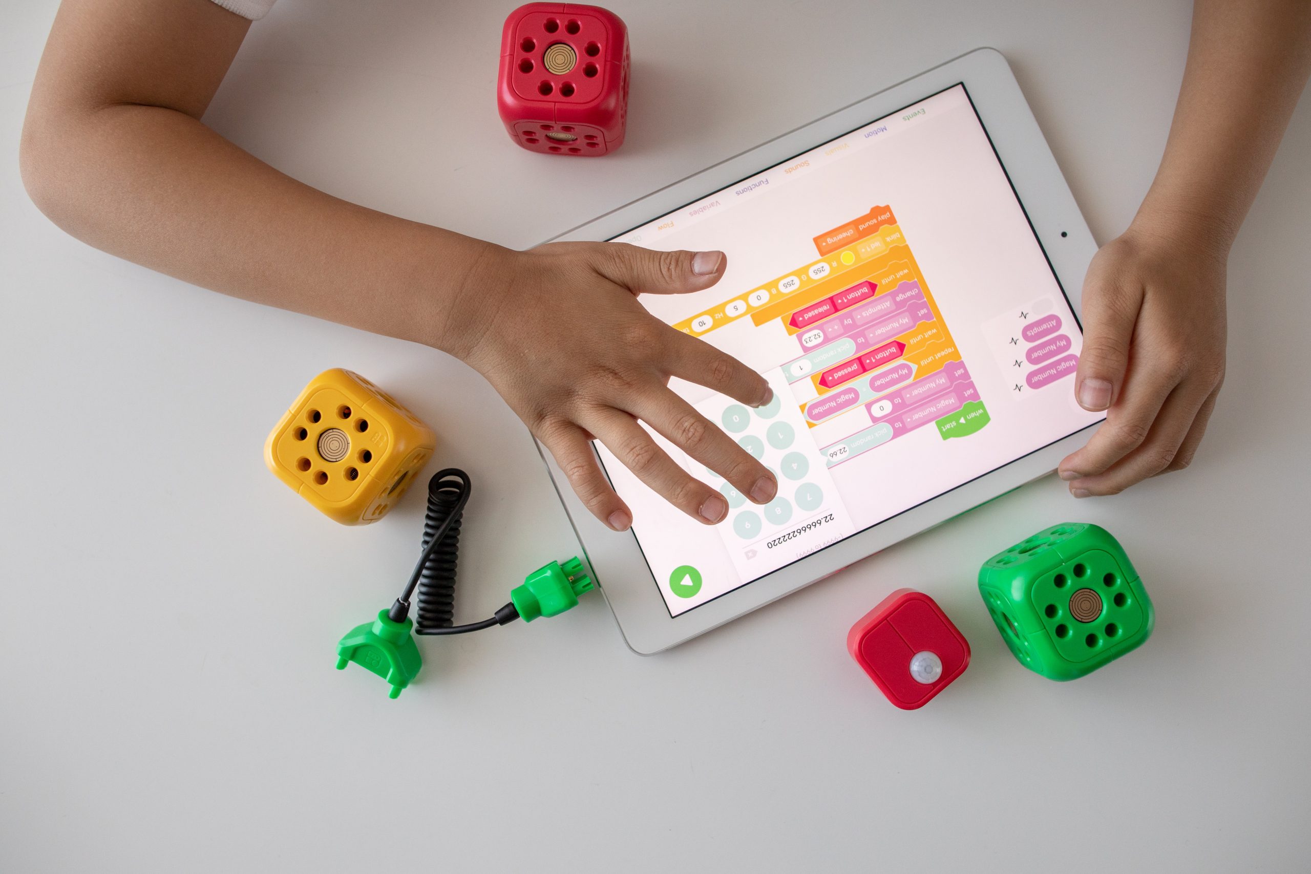 in an article about math games, a kid playing a math game on a tablet