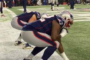 NFL football players crouching before a play