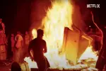 Trainwreck: Woodstock '99 attendees setting things on fire