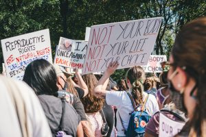 abortion rights protestors holding a sign