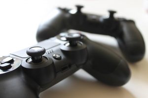 in article about video games, a photo of two video game controllers