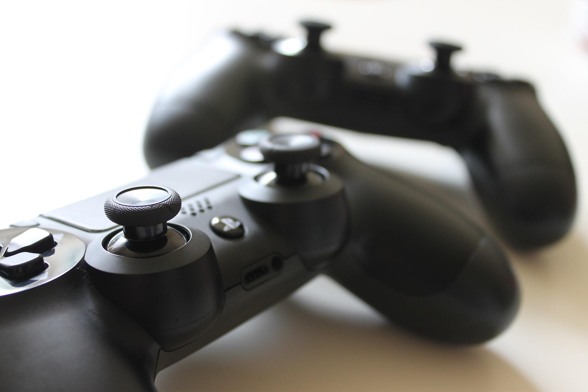 in article about video games, a photo of two video game controllers
