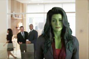 An image of she-hulk shows the title character overhearing two male characters talk