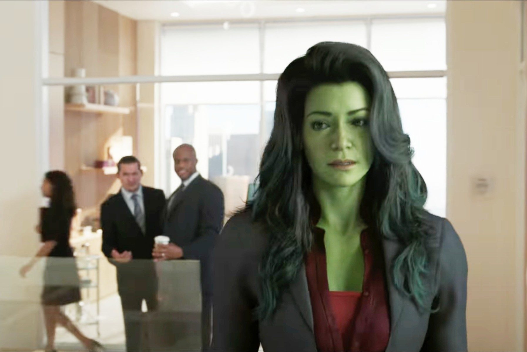 An image of she-hulk shows the title character overhearing two male characters talk