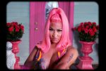 In an article about her famous feuds, Nicki Minaj stares grumpily in her Super Freaky Girl music video
