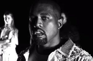 In an article about his antisemitism, Kanye West looks down menacingly