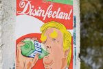 in an article about conspiracy theories a mural of former president Donald Trump drinking disenfectant