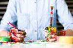in article about creativity, image of a person painting messily